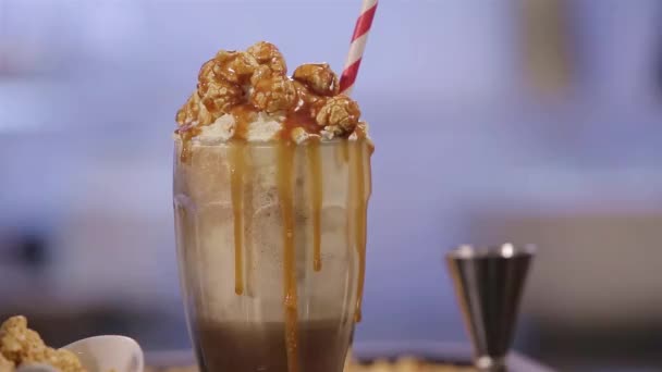 Caramel Covering Popcorn Cream Shake — Stock Video