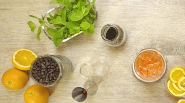Adding Lemon And Ice Slices To The Red Syrup In Glass - Static.