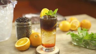 Black Drink with Orange Garnish - Pull Focus.mp4