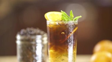 Cold Drinks With Garnish Orange And Leaves - Slide Right To Left