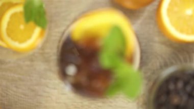 Natural Garnish in Black Drinks - Pull Focus