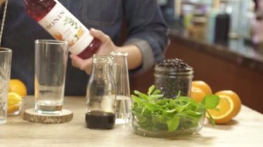 Pouring Red Syrup into the Glass.