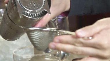 Filter Yellow Drinks into Glass - Close Up