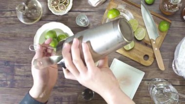 Moving the liquid in the shaker to the glass