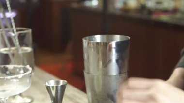 Pouring Liquid into Glass While Filtered - Close Up