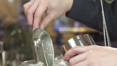 Put Ice Into Shaker With Ice Scoop - Close Up