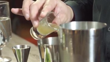  Put Yellow Juice Into Shaker - Close Up