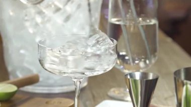  Stir Ice In A Glass With A Spoon - Close Up