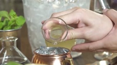 Adding Yellow Syrup Into Small Jug - Close Up