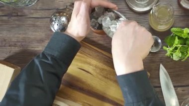 Put the ice in the bag into the small jug