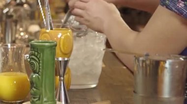 Adding Ice Cubes to Tiki Glass 