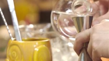 Adding Water To The Shaker And Jigger 