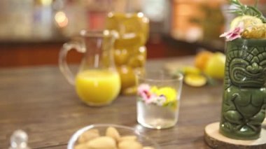 Drinks With Beautiful Garnish On Tiki Glass 