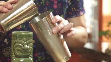 Pour the Yellow Liquid into a Large Shaker and Close it.