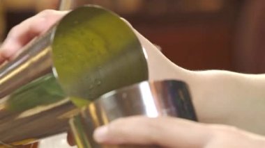 Pour the Drink Mix into the Other Shaker - Close Up