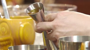 Pour Thick Viscous Liquid Into a Shaker With Jigger - Close Up