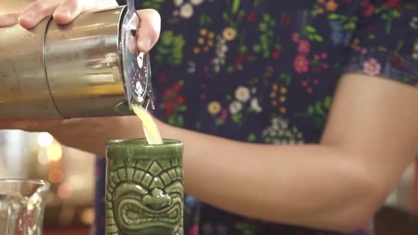 Pouring Yellow Liquid Tiki Glass Close — Stock Video