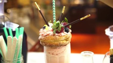 Give a Green Straw to Donut Freakshake - Zoom In