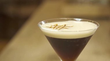 Black Drink With Caramel Garnish - Close Up.