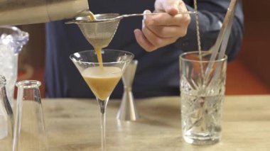 Pouring Liquid From a Shaker with a Filter