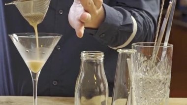 Pouring the Liquid into a Glass with a Filter.