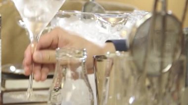 Returning the Ice from the Glass to the Basin.