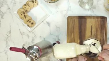 Pouring Milk Into Chocolate While Stirring.