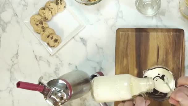 Pouring Milk Chocolate While Stirring — Stok Video