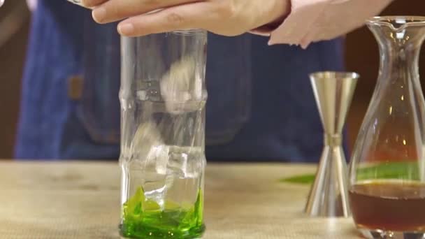 Put Ice Cube Green Syrup Glass — Stok Video