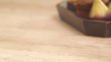 a glass of yogurt on the napkin with blueberry - slide right.