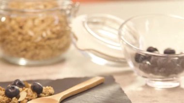 jar of blueberry next to a glass of yogurt - slide left.