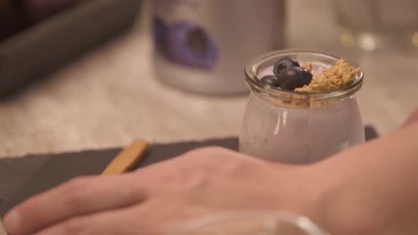 Hand Adjusting Napkin Jar Yogurt Pan Follow — Stockvideo