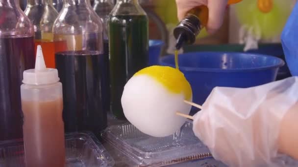 Person Poking Stick Ice Ball Static — Stock Video