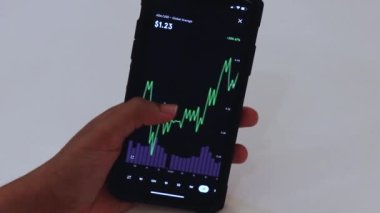 Woman looking through ADA charts on cellphone