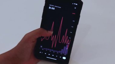 Woman looking through tether charts on app