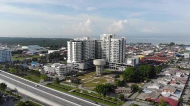 Aerial View Of A Tall Building In Sekinchan - Dolly Forward