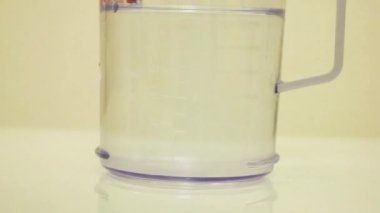 Color Dye Being Added Into Clear Water - Green
