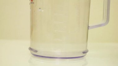 Color Dye Being Added Into Clear Water - Orange
