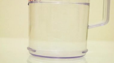 Color Dye Being Added Into Clear Water - Pink