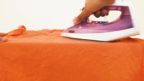 Clothes Being Ironed Ethnic Woman Orange Top — Stock Video
