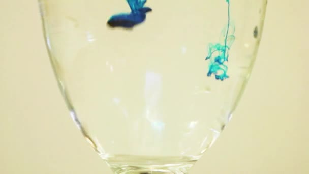 Color Dye Being Added Wine Glass Blue — Stockvideo