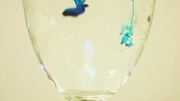 Color Dye Being Added Into Wine Glass - Blue