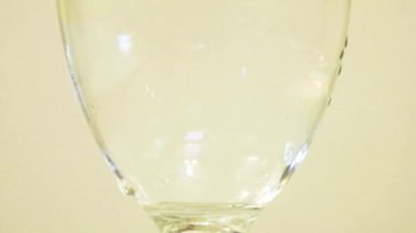 Color Dye Being Added Into Wine Glass -  Dark Yellow