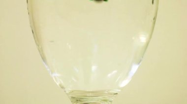 Color Dye Being Added Into Wine Glass - Green
