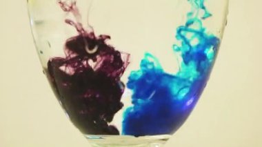 Color Dyes Being Added Into Wine Glass - Blue And Blueberry.