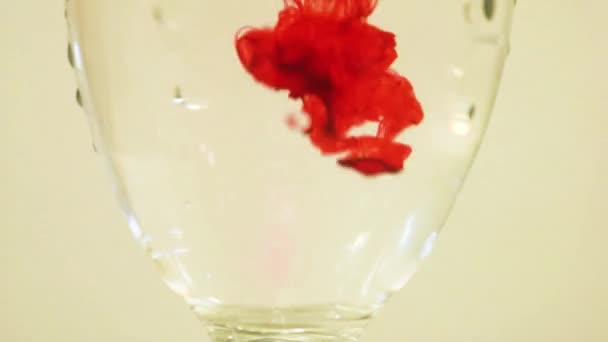 Color Dye Being Added Wine Glass Red — Stock video