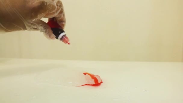 Color Dye Being Mixed White Slime Orange — Video Stock