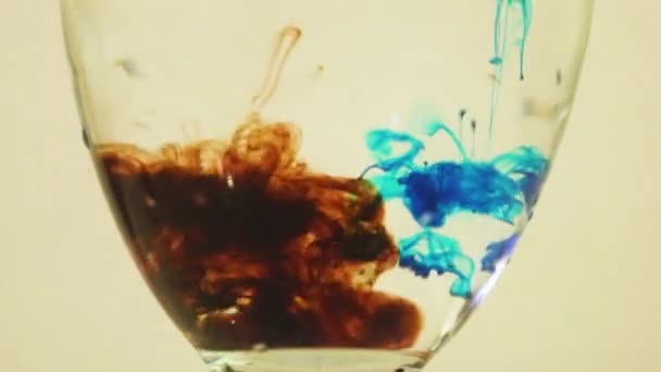 Color Dyes Being Added Wine Glass Blue Brown — Videoclip de stoc