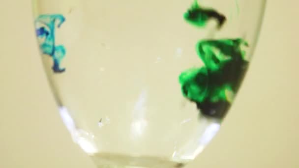 Color Dyes Being Added Wine Glass Blue Green — Stockvideo