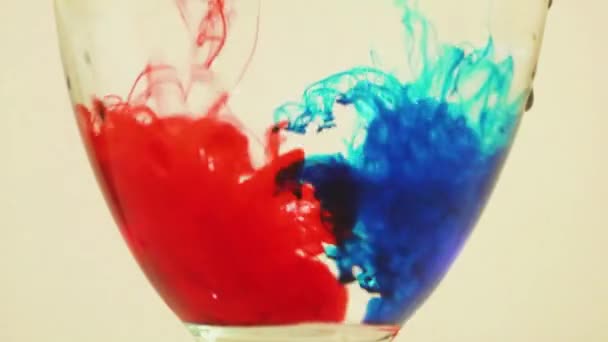 Color Dyes Being Added Wine Glass Blue Red — Stock video